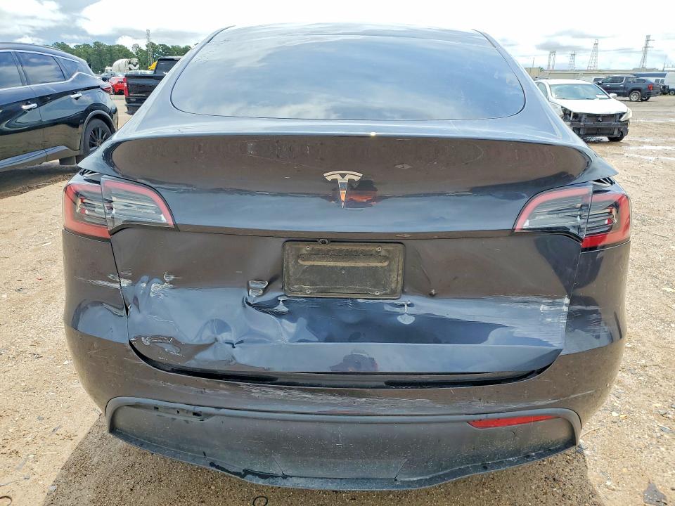 2025 Tesla Model y VIN 7SAYGDED1SA343504 COPART salvage auction — REAR END, TX - SALVAGE VEHICLE TITLE, sold $13,100 on 2026-07-10 (photo 6)