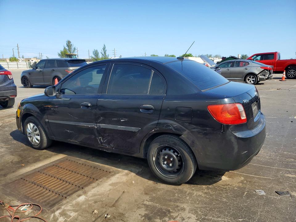 2010 Kia Rio VIN KNADH4A38A6635781 COPART salvage auction — SIDE, Fl - Cert Of Title Slvg Rebuildable, sold $425 on 2026-07-11 (photo 2)