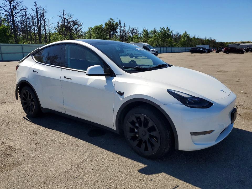 2023 Tesla VIN 7SAYGDEE3PF632418 COPART salvage auction — REAR END, Ny - Mv-907A Salvage Certificate, sold $12,600 on 2026-07-13 (photo 4)