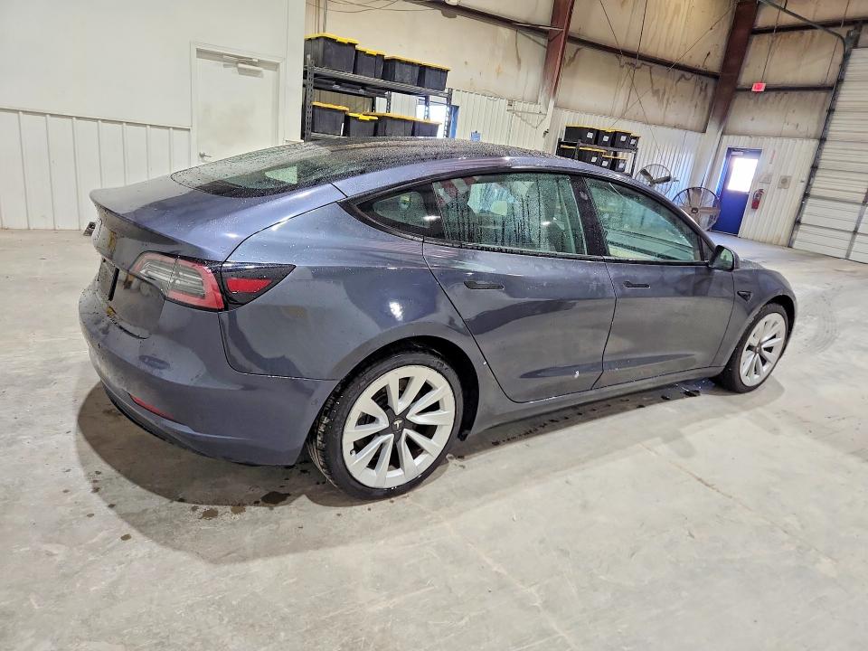 2022 Tesla Model 3 VIN 5YJ3E1EA9NF368563 COPART salvage auction — ALL OVER, Fl - Certificate Of Title, sold $8,600 on 2026-07-06 (photo 3)