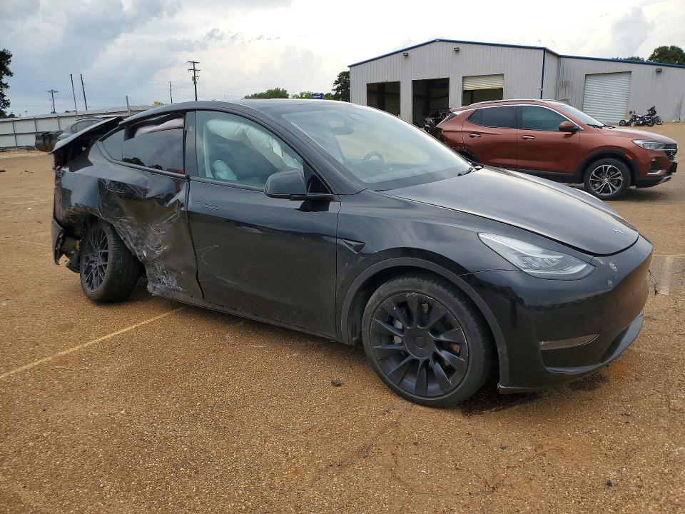2023 Tesla VIN 7SAYGDEE8PA146961 COPART salvage auction — REAR END, TX - SALVAGE VEHICLE TITLE (P), sold $6,300 on 2026-07-20 (photo 4)