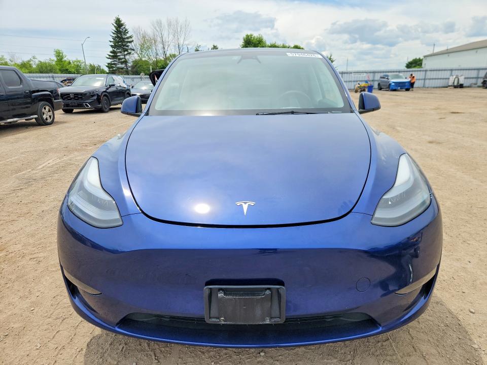 2023 Tesla Model y VIN LRWYGDEE0PC228256 COPART salvage auction — REAR END, ON - PERMIT SALVAGE, sold $10,700 on 2026-07-30 (photo 5)