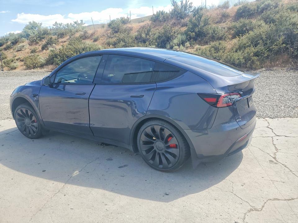 2023 Tesla Model y VIN 7SAYGDEF9PF711908 COPART salvage auction — SIDE, Nv - Salvage Title, sold $10,700 on 2026-07-06 (photo 2)