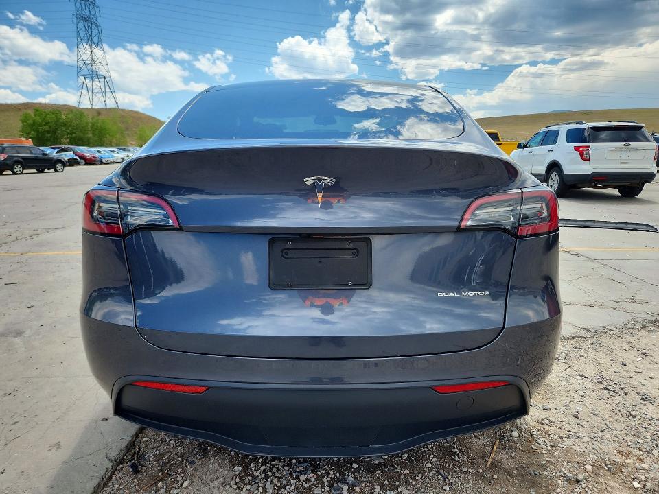 2023 Tesla Model y VIN 7SAYGDEE8PF935484 COPART salvage auction — SIDE, Co - Public - Salvage Title, sold $11,300 on 2026-09-04 (photo 6)