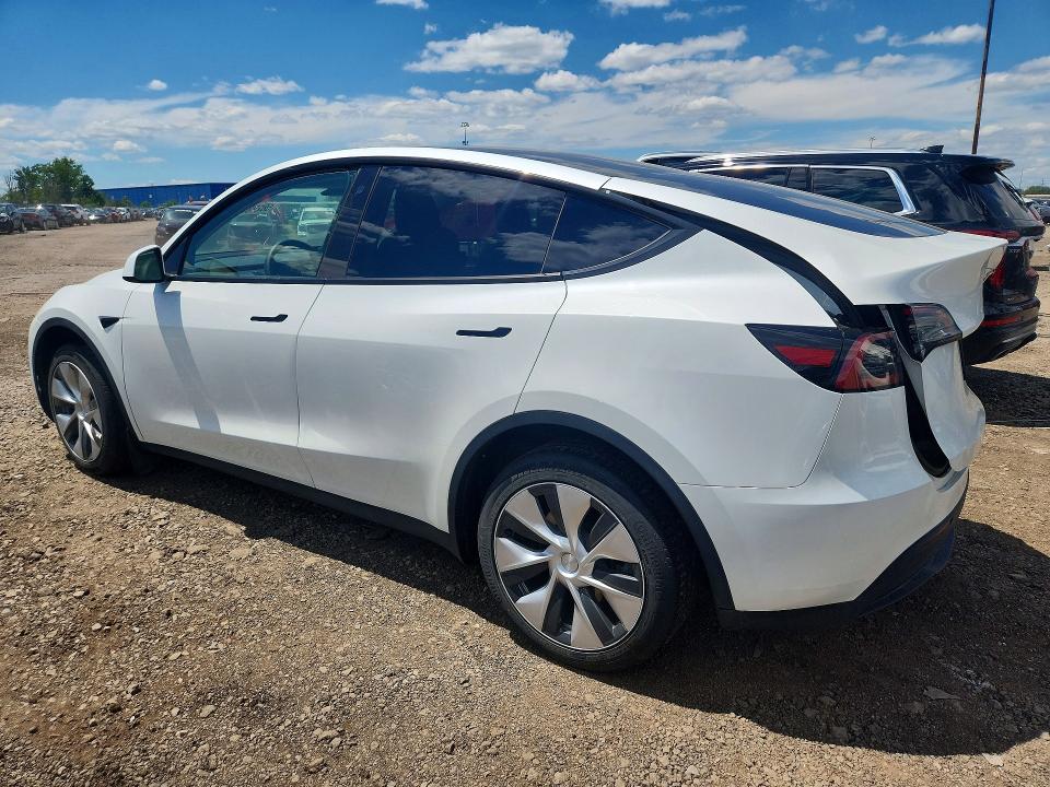 2023 Tesla Model y VIN 7SAYGDEEXPF671829 COPART salvage auction — REAR END, MI - CERTIFICATE OF TITLE, sold $15,600 on 2026-07-10 (photo 2)