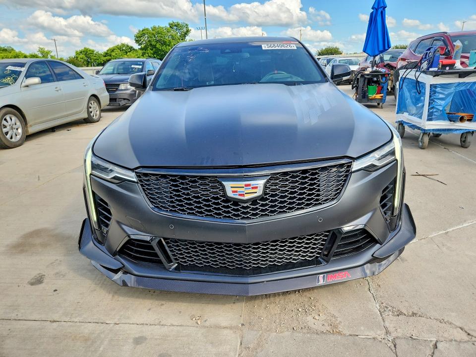2023 Cadillac VIN 1G6DL5RP8P0566037 COPART salvage auction — SIDE, TX - SALVAGE VEHICLE TITLE, sold $27,750 on 2026-08-13 (photo 5)