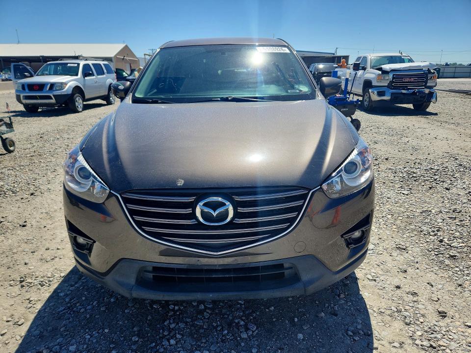 2016 Mazda Cx-5 VIN JM3KE4CY6G0855452 COPART salvage auction — SIDE, Co - Public - Salvage Title, sold $4,700 on 2026-07-07 (photo 5)