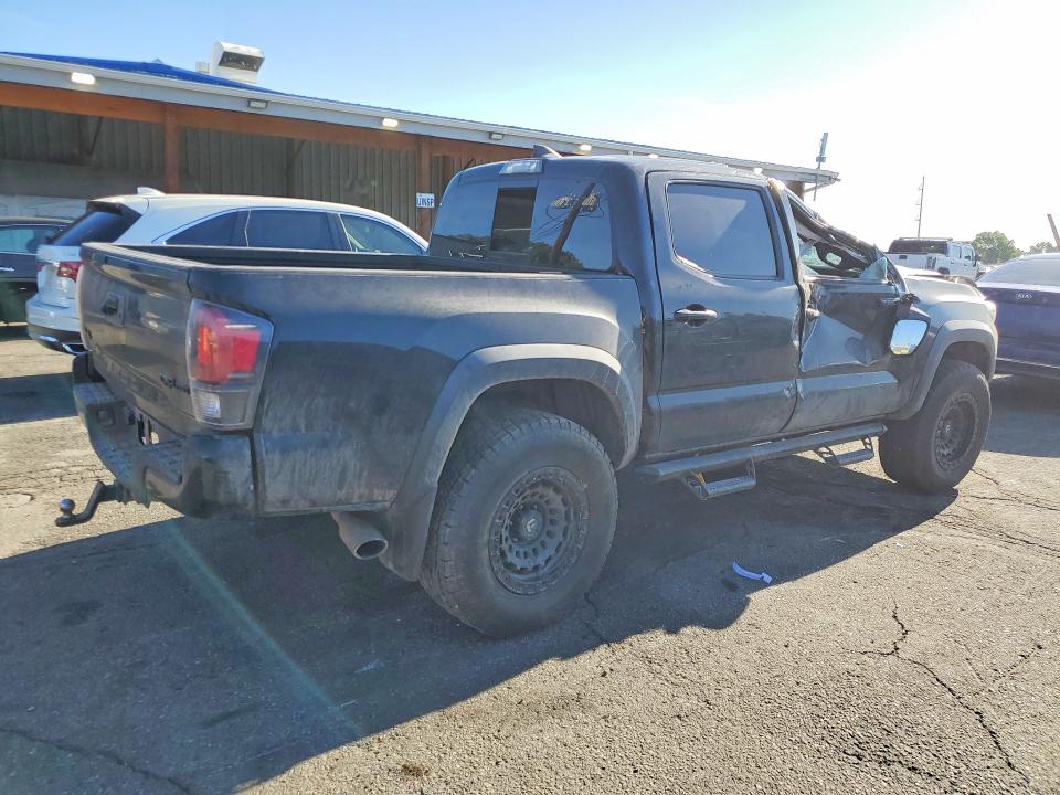 2019 Toyota Tacoma VIN 5TFCZ5AN7KX209708 COPART salvage auction — ROLLOVER, Co - Public - Salvage Title, sold $9,000 on 2026-07-09 (photo 3)