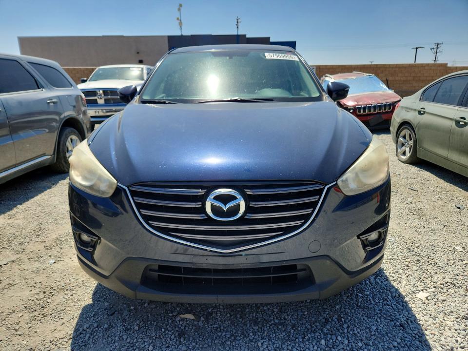 2016 Mazda VIN JM3KE2CY0G0834990 COPART salvage auction — SIDE, Ca - Salvage Certificate, sold $2,950 on 2026-07-15 (photo 5)