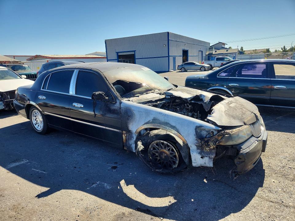 1998 Lincoln TOWN CAR VIN 1LNFM82W9WY669730 COPART salvage auction — ENGINE BURN, Nv - Non-Repairable Vehicle Cert, sold $125 on 2026-07-08 (photo 4)
