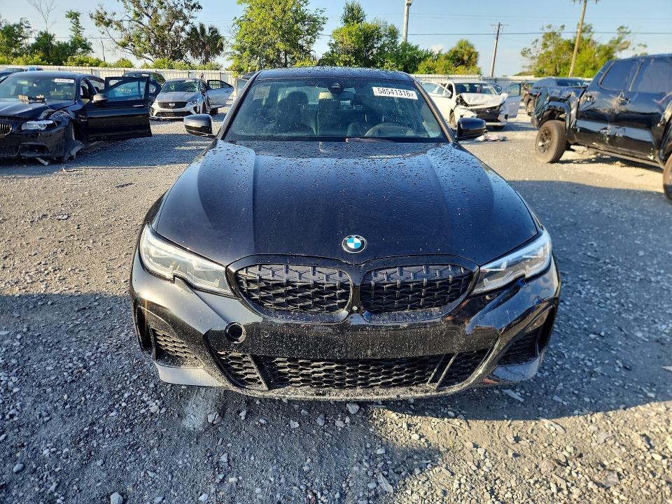 2021 BMW M3 VIN 3MW5U9J07M8B65498 COPART salvage auction — NORMAL WEAR, Fl - Cert Of Title-Flood & Rebuilt (P), sold $22,900 on 2026-07-22 (photo 5)