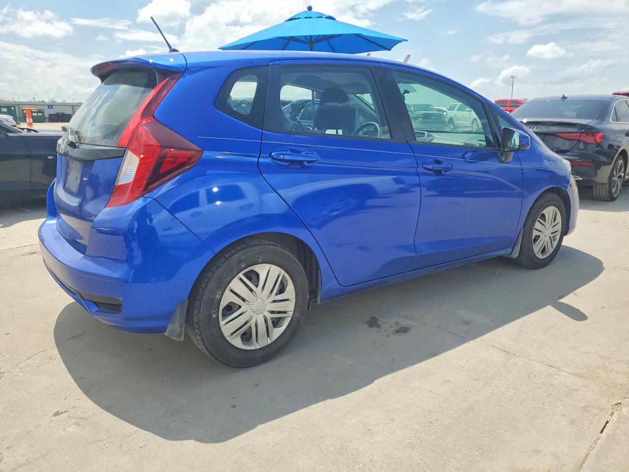 2019 Honda Fit VIN 3HGGK5H4XKM700090 COPART salvage auction — Side, TX - SALVAGE VEHICLE TITLE, sold $2,250 on 2026-07-09 (photo 3)