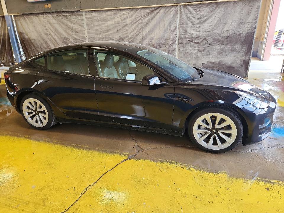 2023 Tesla Model 3 VIN 5YJ3E1EA7PF437527 COPART salvage auction — REAR END, In - Certificate Of Title, sold $9,200 on 2026-07-06 (photo 4)