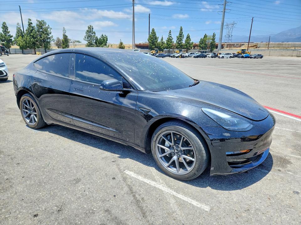 2023 Tesla Model 3 VIN 5YJ3E1EB9PF655154 COPART salvage auction — REAR END, CA - SALVAGE CERTIFICATE, sold $7,700 on 2026-07-28 (photo 4)