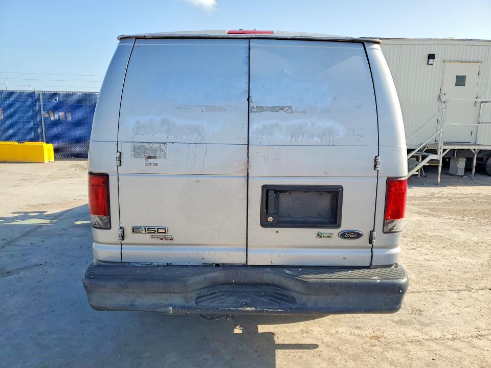 2014 Ford VIN 1FTNE1EW8EDB05699 COPART salvage auction — MINOR DENT/SCRATCHES, Fl - Certificate Of Title, sold $1,000 on 2026-07-09 (photo 6)