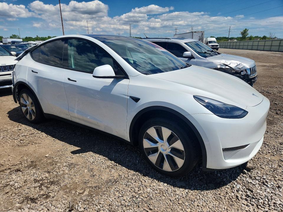 2023 Tesla Model y VIN 7SAYGDEEXPF671829 COPART salvage auction — REAR END, MI - CERTIFICATE OF TITLE, sold $15,600 on 2026-07-10 (photo 4)