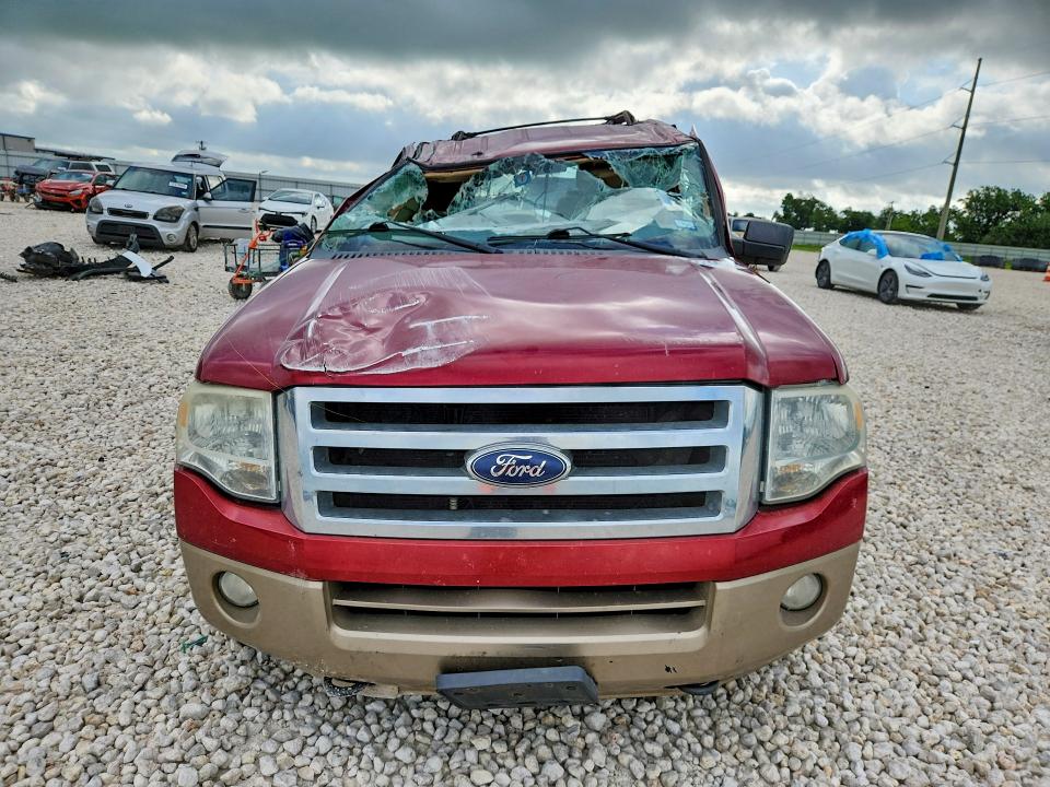2014 Ford VIN 1FMJU1J56EEF18418 COPART salvage auction — ROLLOVER, Tx - Salvage Vehicle Title, sold $600 on 2026-07-02 (photo 5)