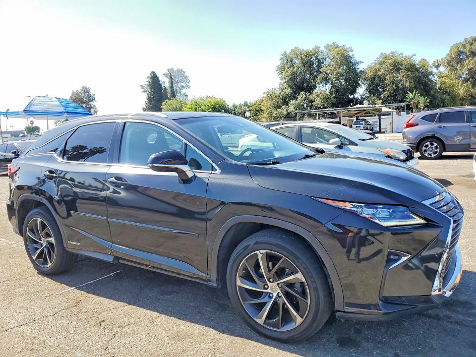 2017 Lexus Rx 450h VIN 2T2BGMCA9HC011706 COPART salvage auction — MINOR DENT/SCRATCHES, Ca - Dis/Dlr/Exp Only Clean Title, sold $18,200 on 2026-07-17 (photo 4)