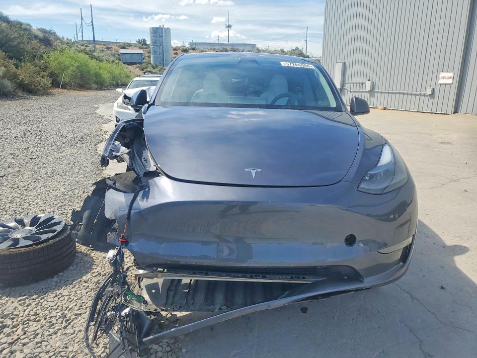 2023 Tesla Model y VIN 7SAYGDEF9PF711908 COPART salvage auction — SIDE, Nv - Salvage Title, sold $10,700 on 2026-07-06 (photo 5)