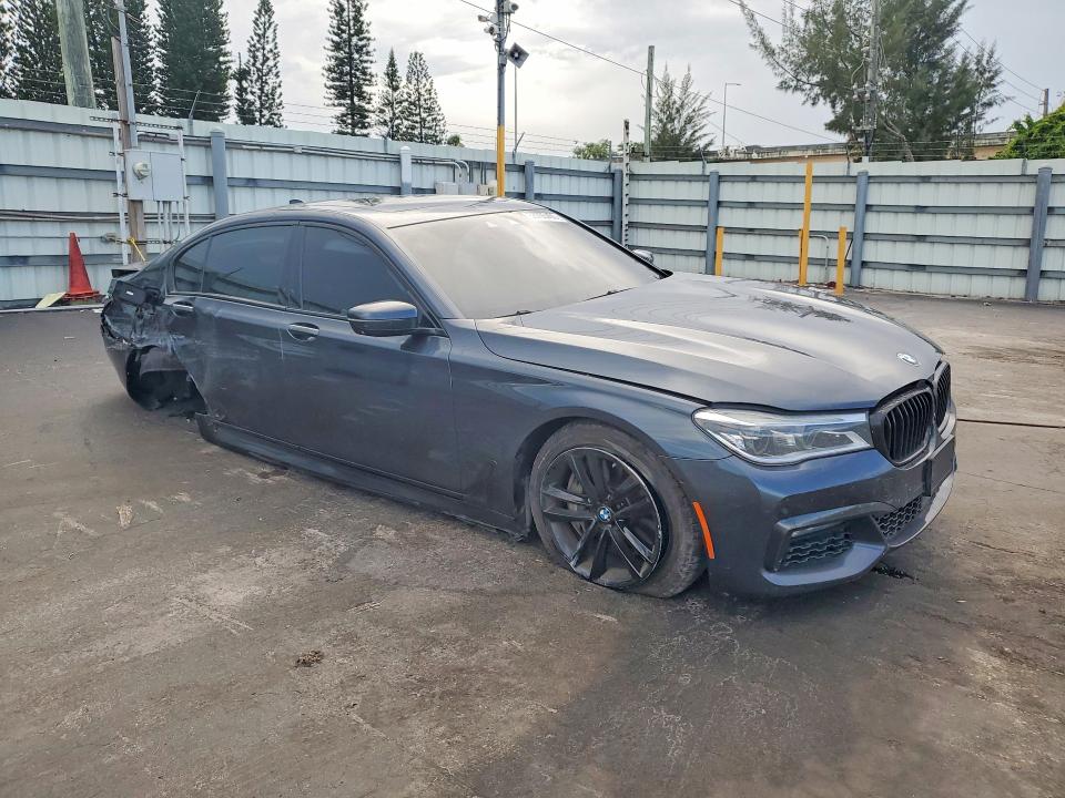 2016 BMW 7er VIN WBA7F2C52GG418655 COPART salvage auction — SIDE, Fl - Cert Of Title Slvg Rebuildable, sold $5,000 on 2026-07-08 (photo 4)