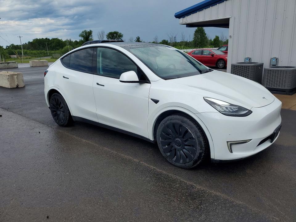 2023 Tesla Model y VIN 7SAYGDEE1PF611177 COPART salvage auction — REAR END, Ny - Cert Of Title-Rebuilt Salvage, sold $14,300 on 2026-07-06 (photo 4)