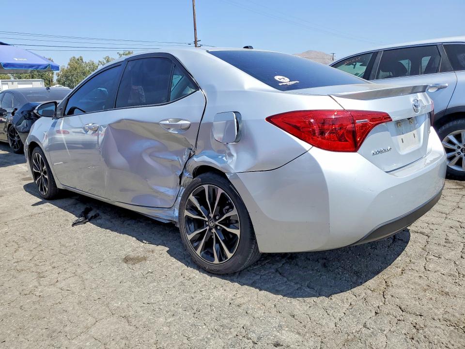 2017 Toyota Corolla VIN 5YFBURHE3HP594005 COPART salvage auction — SIDE, Salvage Title, sold $4,550 on 2026-07-16 (photo 2)