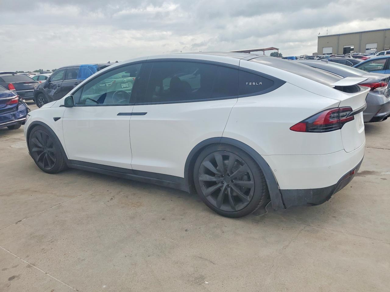 2021 Tesla Model X VIN 5YJXCBE29MF322851 COPART salvage auction — Side, TX - SALVAGE W/LEMON LAW HISTORTY, sold $16,500 on 2026-07-02 (photo 2)