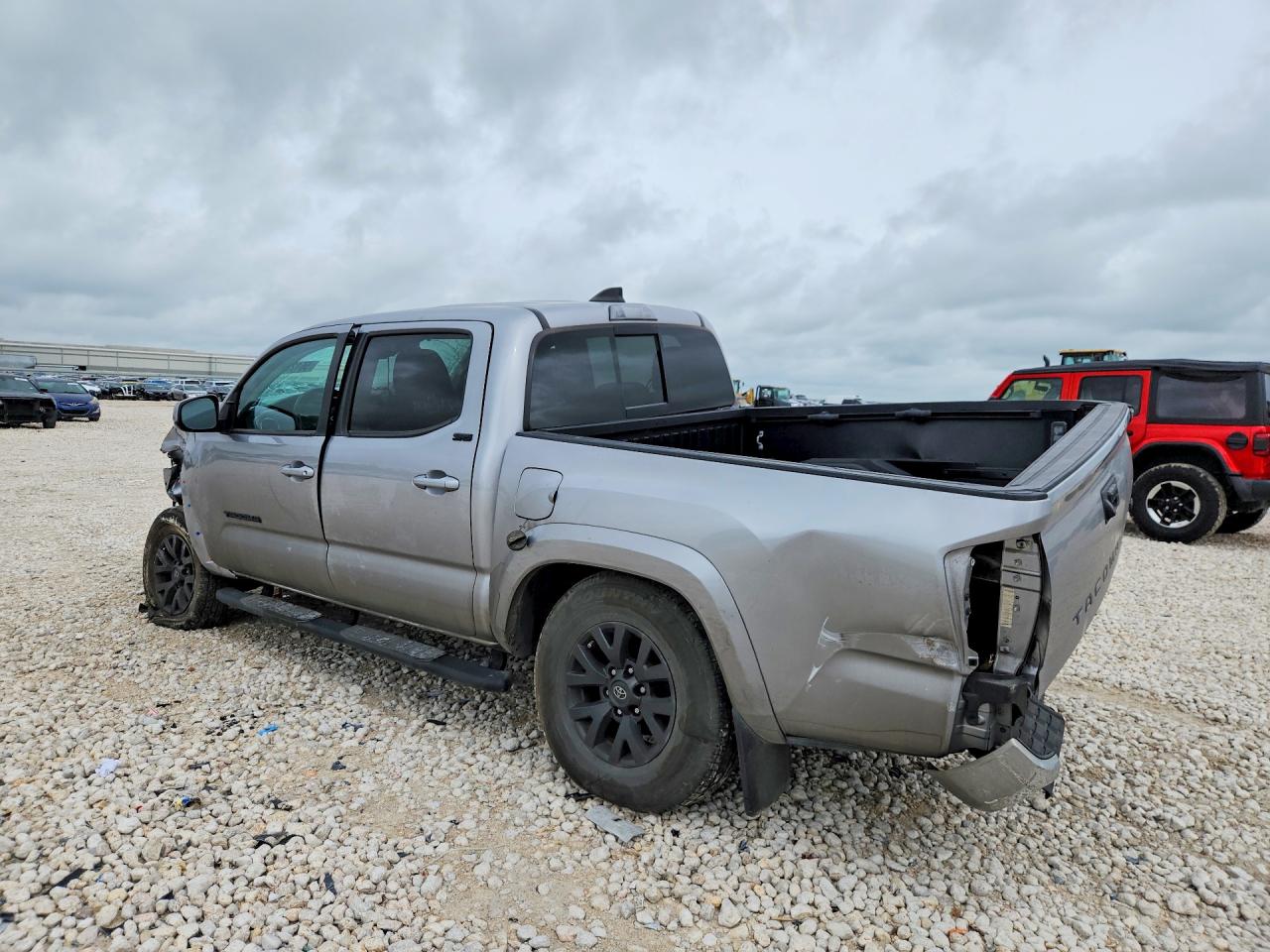 2020 Toyota Tacoma VIN 5TFAZ5CNXLX094317 COPART salvage auction — Side, TX - SALVAGE VEHICLE TITLE (P), sold $4,350 on 2026-07-02 (photo 2)