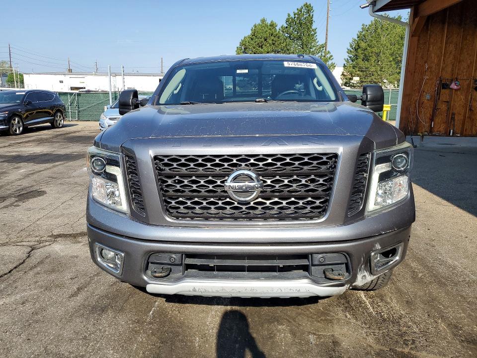 2018 Nissan VIN 1N6AA1E55JN538979 COPART salvage auction — SIDE, Co - Public - Salvage Title, sold $6,300 on 2026-07-28 (photo 5)
