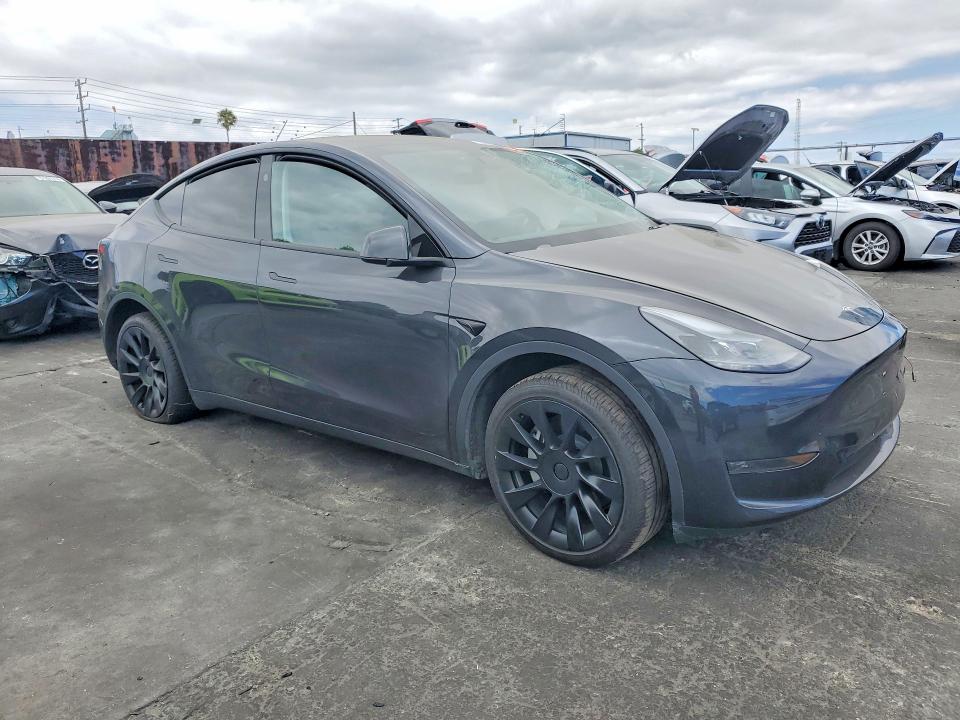 2024 Tesla Model y VIN 7SAYGDED1RF008207 COPART salvage auction — SIDE, Ca - Dis/Dlr/Exp Only Clean Title (P), sold $10,700 on 2026-07-29 (photo 4)