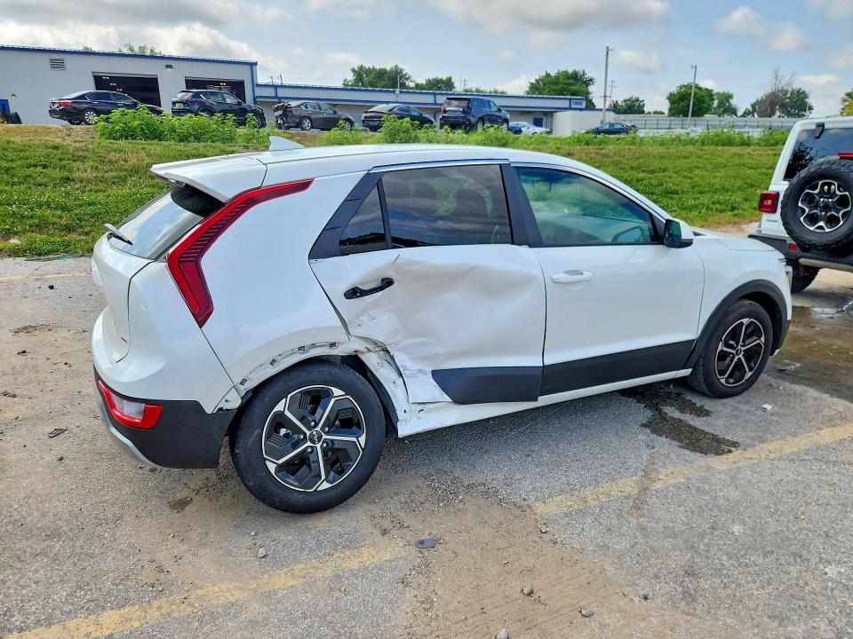 2026 Kia Niro VIN KNDCP3LE0T5329175 COPART salvage auction — SIDE, Tx - Certificate Of Title, sold $10,700 on 2026-07-08 (photo 3)