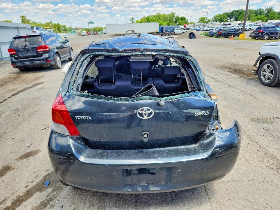 2009 Toyota Yaris VIN JTDJT903295233856 COPART salvage auction — ALL OVER, IN - CERT OF TITLE-SALVAGE TITLE (P), sold $225 on 2026-07-27 (photo 6)
