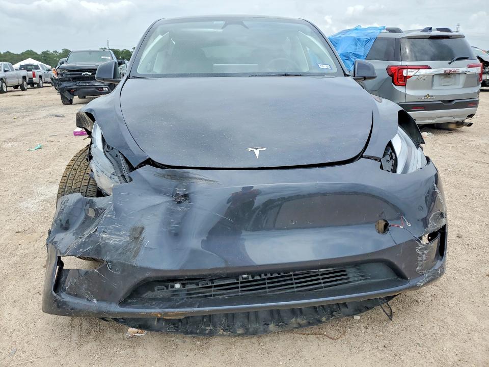2025 Tesla Model y VIN 7SAYGDEE9SA353397 COPART salvage auction — FRONT END, TX - SALVAGE VEHICLE TITLE (P), sold $14,000 on 2026-07-17 (photo 5)