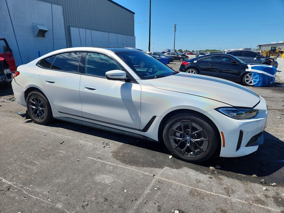 2023 BMW I4 VIN WBY73AW05PFN86882 COPART salvage auction — REAR END, Fl - Cert Of Title Slvg Rebuildable, sold $14,100 on 2026-08-03 (photo 4)