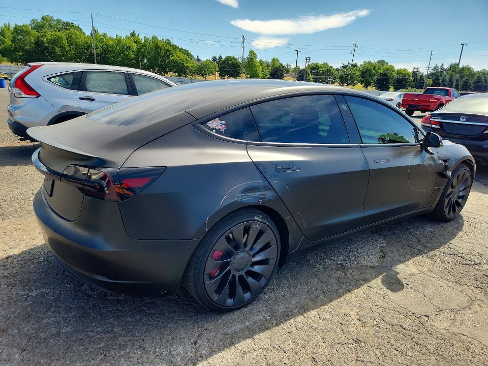 2022 Tesla Model 3 VIN 5YJ3E1EC7NF129773 COPART salvage auction — SIDE, Or - Salvage Title Certificate, sold $1,050 on 2026-07-29 (photo 3)