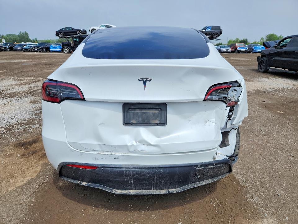 2023 Tesla Model y VIN LRWYGDFDXPC901706 COPART salvage auction — REAR END, On - Permit Salvage, sold $6,600 on 2026-07-28 (photo 6)