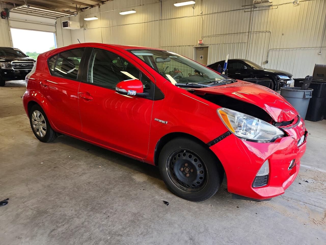 2014 Toyota Prius C VIN JTDKDTB33E1560327 COPART salvage auction — Front End, MN - CERT OF TITLE-PRIOR SALVAGE, sold $1,200 on 2026-07-09 (photo 4)