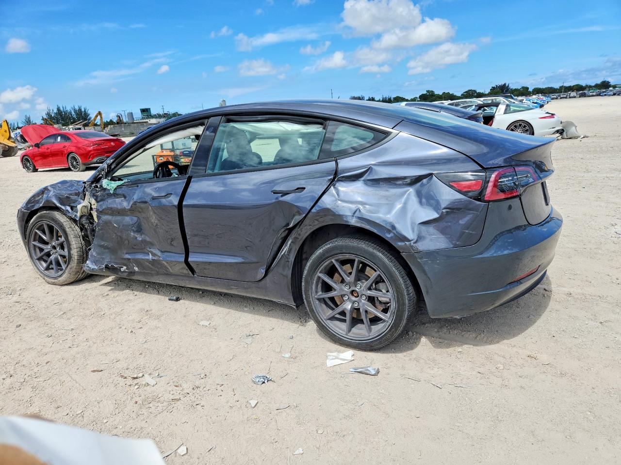 2023 Tesla Model 3 VIN 5YJ3E1EA7PF697474 COPART salvage auction — Side, MD - CERTIFICATE OF TITLE, sold $5,900 on 2026-07-03 (photo 2)