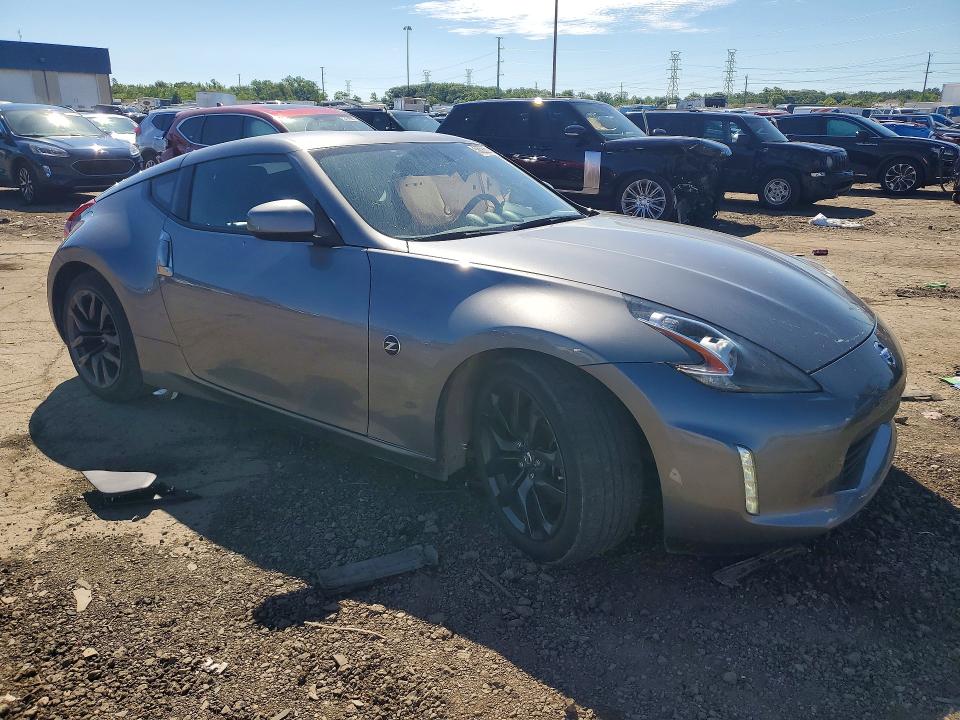 2018 Nissan VIN JN1AZ4EH7JM570347 COPART salvage auction — SIDE, Mi - Certificate Of Title, sold $8,000 on 2026-07-14 (photo 4)