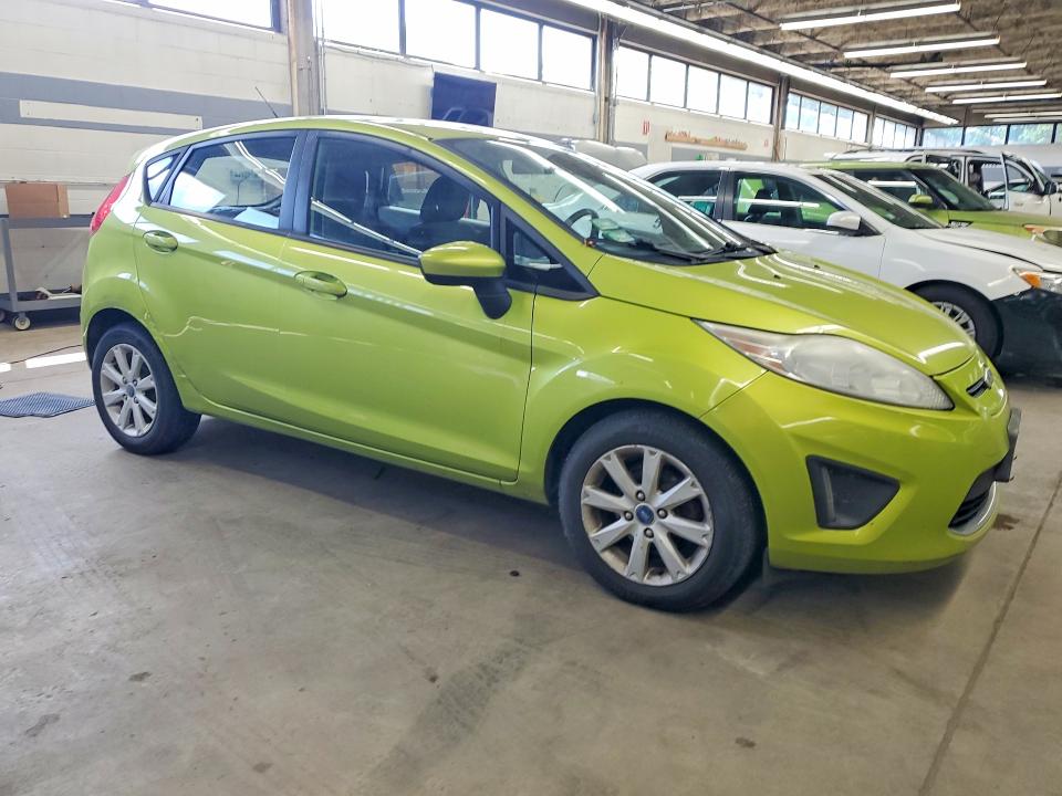 2012 Ford Fiesta VIN 3FADP4EJ9CM101860 COPART salvage auction — MINOR DENT/SCRATCHES, Il - Certificate Of Title, sold $325 on 2026-07-09 (photo 4)