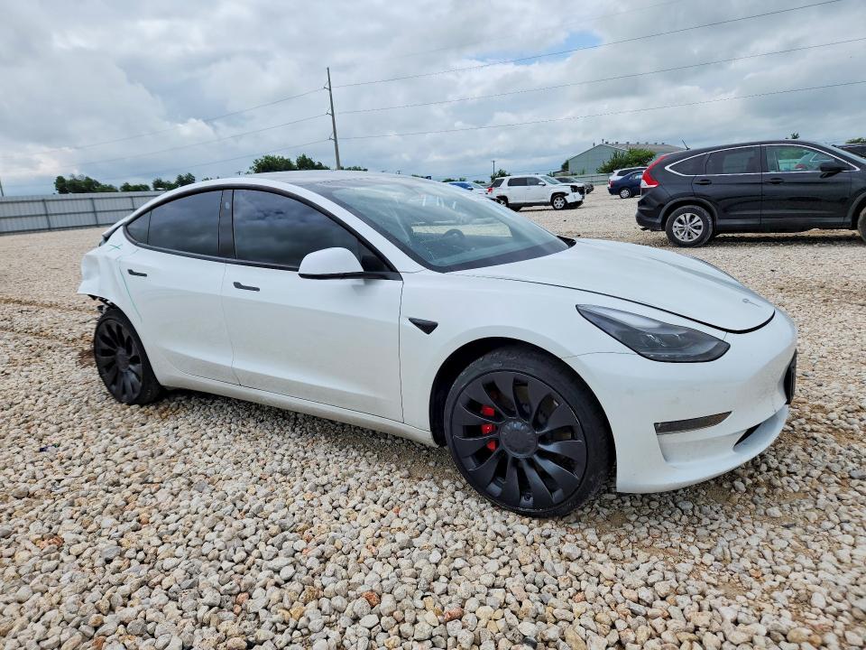 2023 Tesla VIN 5YJ3E1EC8PF503097 COPART salvage auction — REAR END, Tx - Salvage Vehicle Title, sold $2,500 on 2026-07-30 (photo 4)