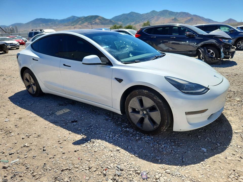 2021 Tesla Model 3 VIN 5YJ3E1EB8MF928242 COPART salvage auction — SIDE, UT - SALVAGE CERTIFICATE, sold $7,600 on 2026-07-31 (photo 4)