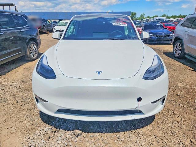 2023 Tesla Model y VIN 7SAYGDEEXPF671829 COPART salvage auction — REAR END, MI - CERTIFICATE OF TITLE, sold $15,600 on 2026-07-10 (photo 5)