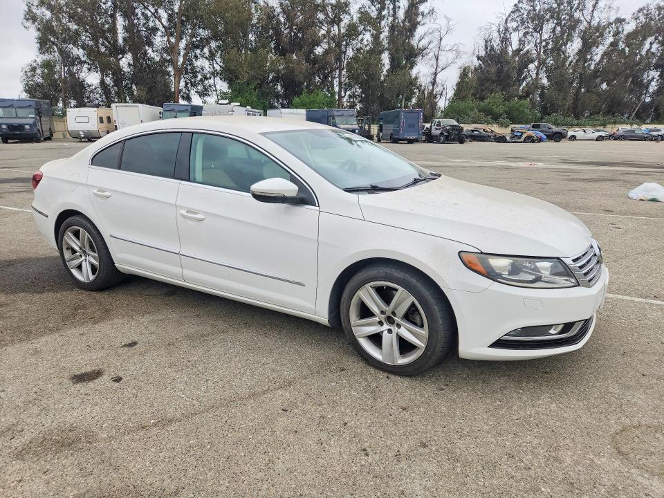 2014 Volkswagen Passat cc VIN WVWBP7AN4EE535804 COPART salvage auction — NORMAL WEAR, Ca - Dis/Dlr/Exp Only Clean Title (P), sold $600 on 2026-07-28 (photo 4)