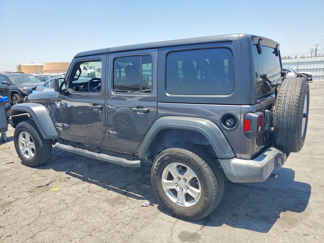 2018 Jeep Wrangler Unlimited VIN 1C4HJXDNXJW145348 COPART salvage auction — Minor Dent/Scratches, FL - DERELICT VEHICLE CERTIFICATE, sold $9,900 on 2026-07-02 (photo 2)