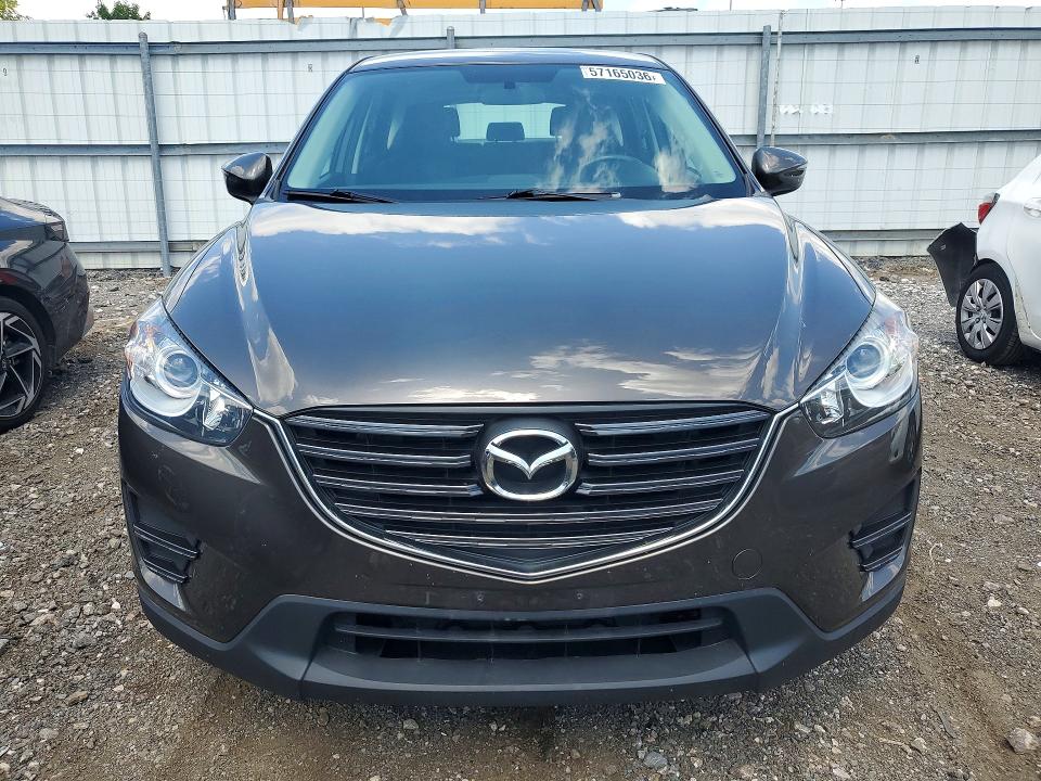 2016 Mazda VIN JM3KE4BY1G0751680 COPART salvage auction — SIDE, Md - Cert Of Salvage > 75% Damage, sold $2,000 on 2026-07-27 (photo 5)