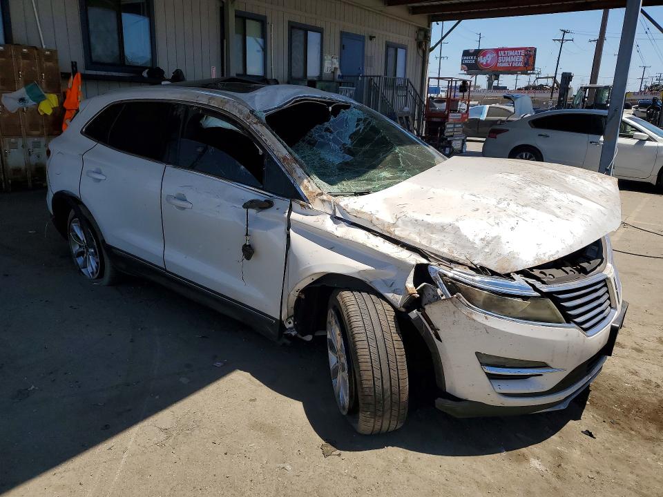 2015 Lincoln Mkz VIN 5LMCJ1A90FUJ15866 COPART salvage auction — ROLLOVER, Ca - Salvage Certificate, sold $425 on 2026-07-02 (photo 4)