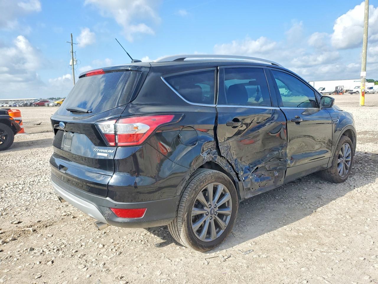 2017 Ford Escape VIN 1FMCU0J98HUD84298 COPART salvage auction — Side, TX - SALVAGE VEHICLE TITLE, sold $2,300 on 2026-07-02 (photo 3)