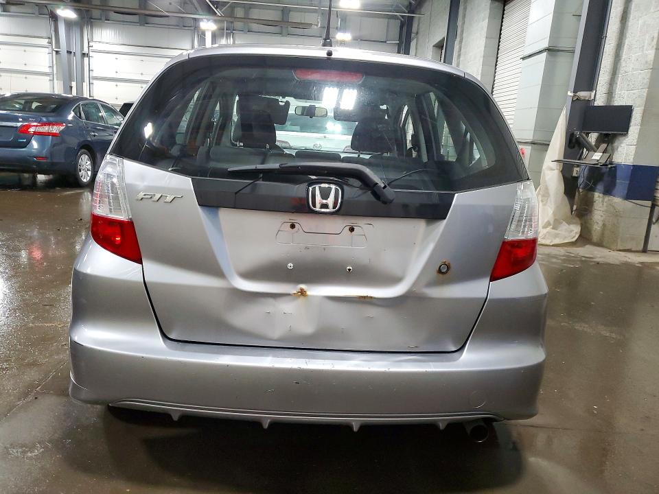 2009 Honda Fit VIN JHMGE88259S050655 COPART salvage auction — SIDE, Mn - Cert Of Title-Prior Salvage, sold $625 on 2026-07-07 (photo 6)