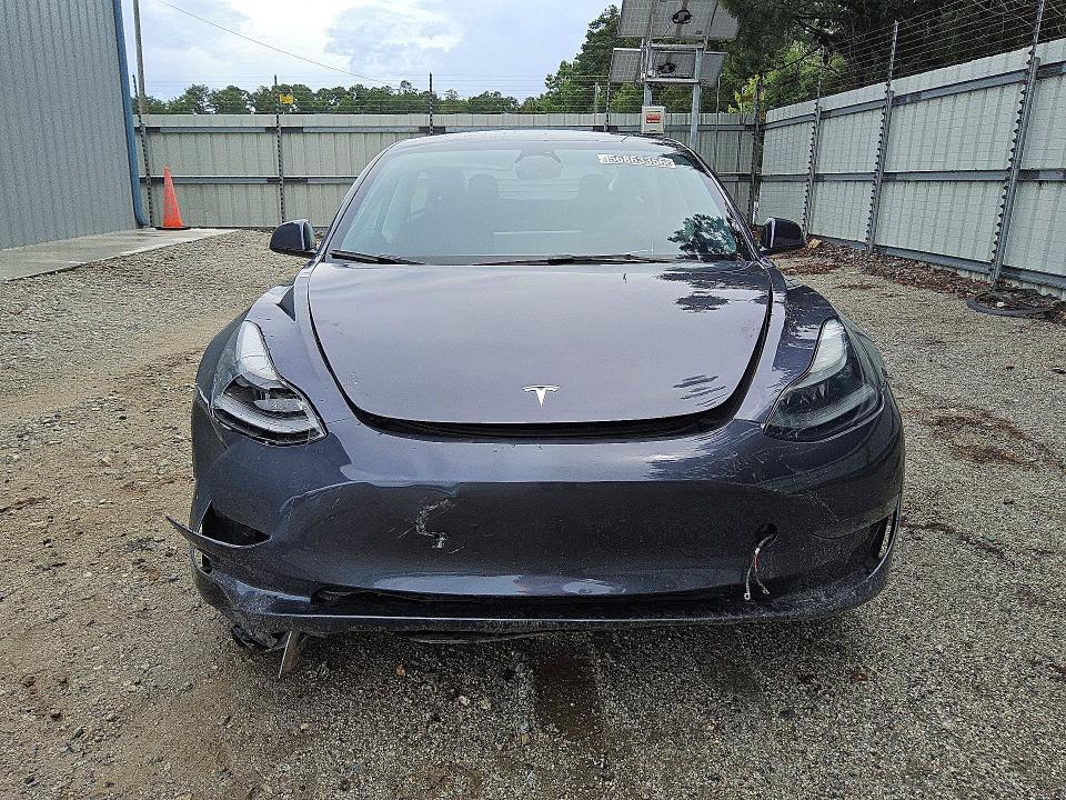 2023 Tesla Model 3 VIN 5YJ3E1EA5PF491330 COPART salvage auction — SIDE, GA - CERTIFICATE OF TITLE (P), sold $7,700 on 2026-07-16 (photo 5)